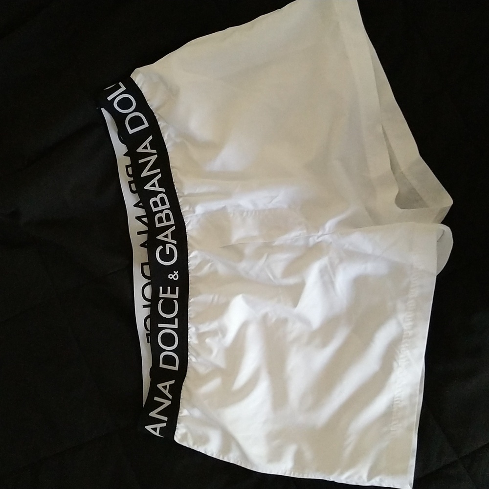 Dolce & Gabbana swim trunks. White with black waist ban. Size medium